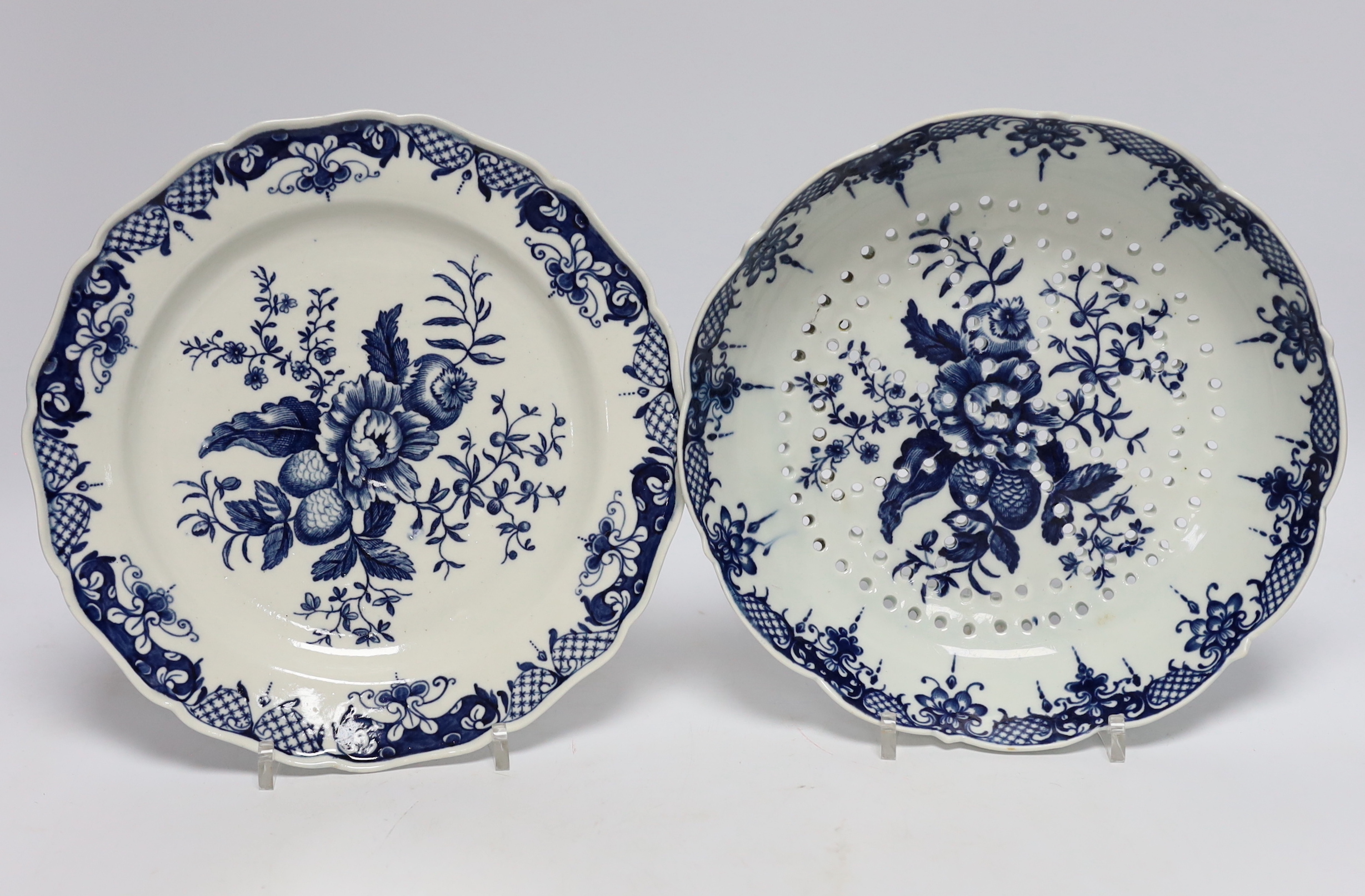 An 18th century Worcester Chinese style teapot, and a similar pine cone pattern strainer and plate (3)